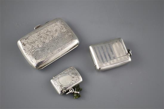 An Edwardian engraved silver cigarette case, Samuel M. Levi, Birmingham, 1905 and two similar vesta cases,